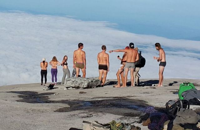 Goofing off on Mount Kinabula. It's all fun and games until you're thrown into a Malaysian prison. (photo from Mount Kinabula Facebook page)